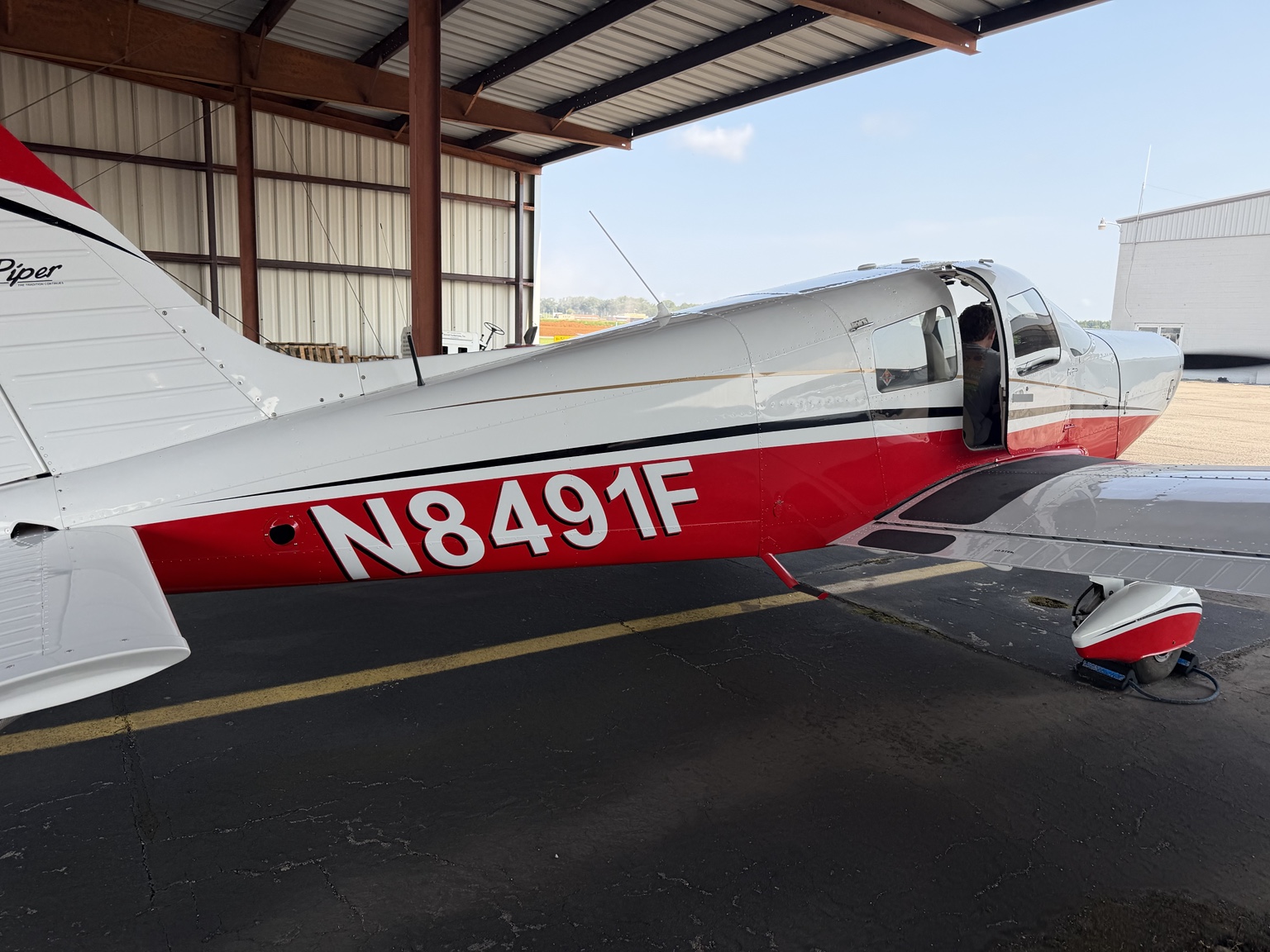 Hutzell Aviation Piper PA-28-140 N8491F parked at the hangar